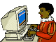 Zwarte Piet zit te typen op zijn computer